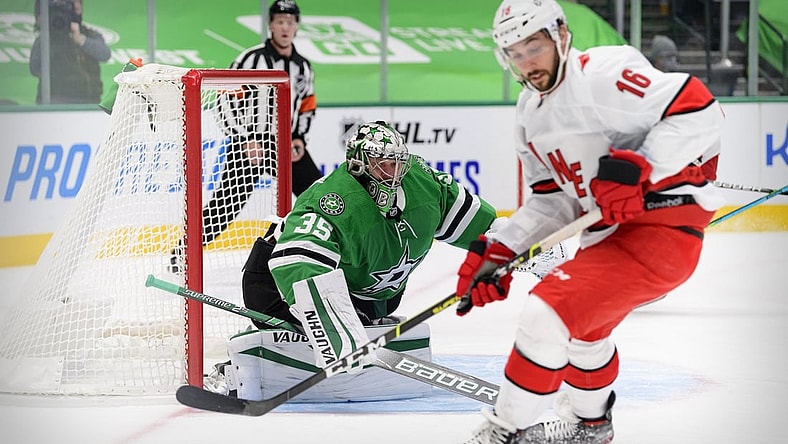 Feb 11, 2021; Dallas, Texas, USA; Dallas Stars goaltender Anton Khudobin (35) defends the goal against Carolina Hurricanes center Vincent Trocheck (16) during the first period at the American Airlines Center. Mandatory Credit: Jerome Miron-USA TODAY Sports
