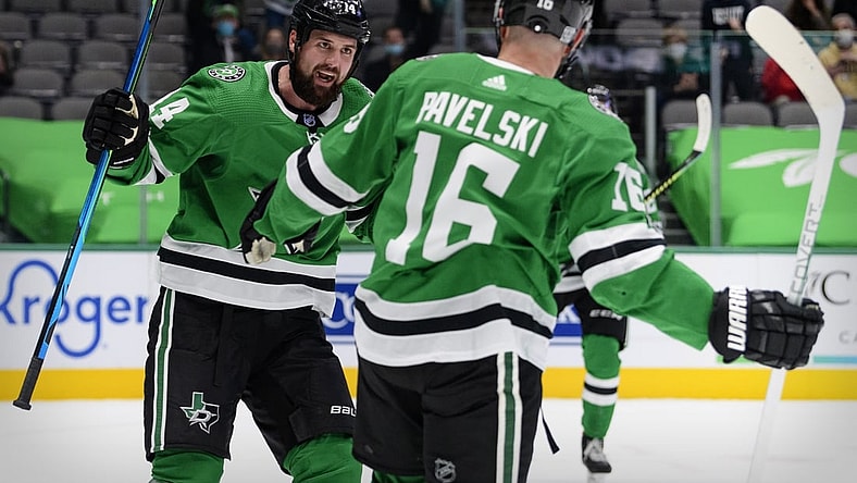 Feb 11, 2021; Dallas, Texas, USA; Dallas Stars left wing Jamie Benn (14) and center Joe Pavelski (16) celebrate Pavelski scoring a goal against the Carolina Hurricanes during the second period at the American Airlines Center. Mandatory Credit: Jerome Miron-USA TODAY Sports