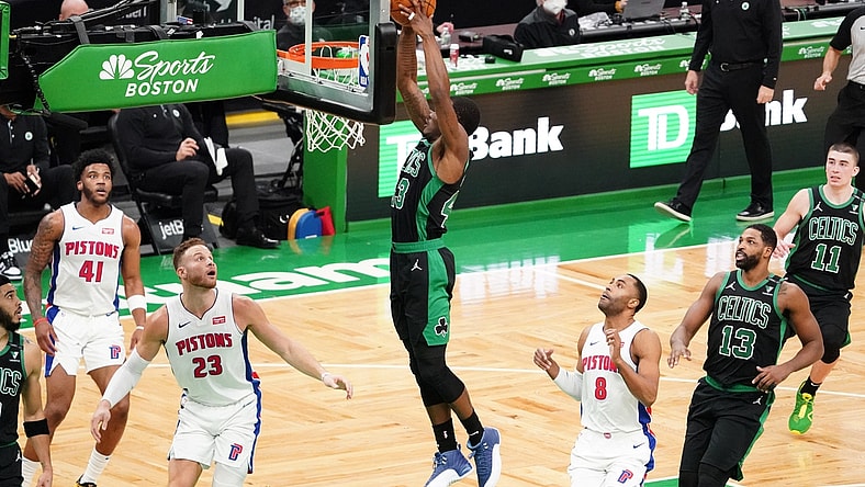 Feb 12, 2021; Boston, Massachusetts, USA; Boston Celtics guard Javonte Green (43) makes the basket against Detroit Pistons forward Blake Griffin (23) in the second quarter at TD Garden. Mandatory Credit: David Butler II-USA TODAY Sports