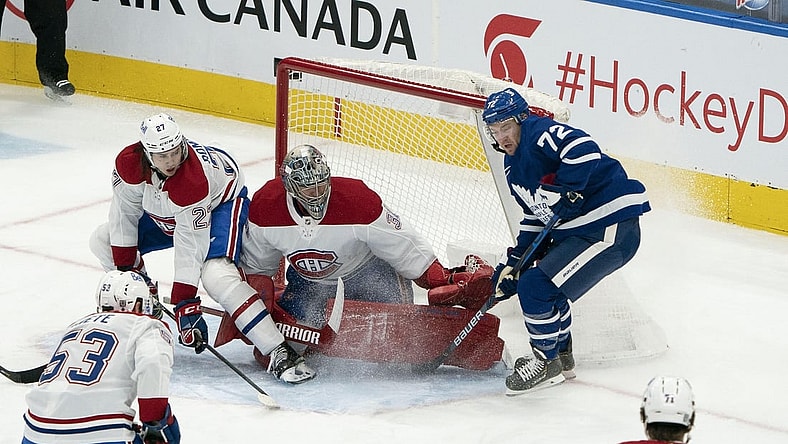 Feb 13, 2021; Toronto, Ontario, CAN; Toronto Maple Leafs center Travis Boyd (72) battles for a puck in front of Montreal Canadiens goaltender Carey Price (31) during the second period at Scotiabank Arena. Mandatory Credit: Nick Turchiaro-USA TODAY Sports