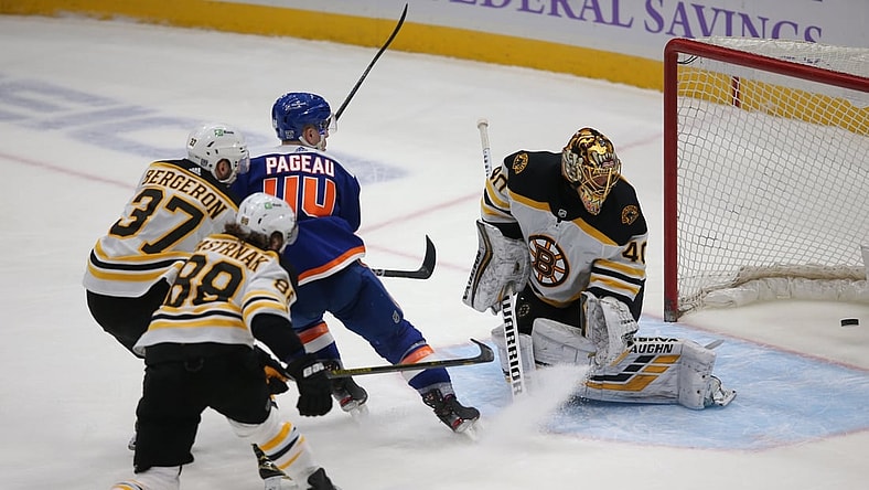 Feb 13, 2021; Uniondale, New York, USA; New York Islanders center Jean-Gabriel Pageau (44) scores a short handed goal against Boston Bruins goalie Tuukka Rask (40) in front of Bruins center Patrice Bergeron (37) and right wing David Pastrnak (88) during the third period at Nassau Veterans Memorial Coliseum. Mandatory Credit: Brad Penner-USA TODAY Sports