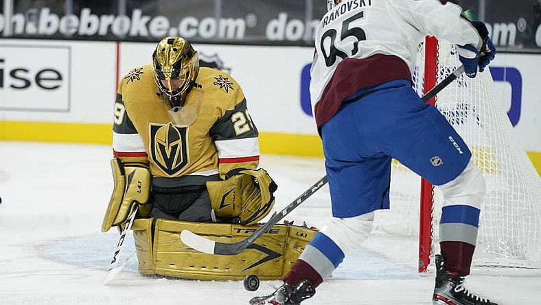 Feb 14, 2021; Las Vegas, Nevada, USA; Vegas Golden Knights goaltender Marc-Andre Fleury (29) blocks a shot by Colorado Avalanche left wing Andre Burakovsky (95) during the first period at T-Mobile Arena. Mandatory Credit: John Locher/Pool Photo-USA TODAY Sports