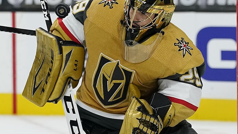 Feb 14, 2021; Las Vegas, Nevada, USA; Vegas Golden Knights goaltender Marc-Andre Fleury (29) blocks a shot by the Colorado Avalanche during the third period at T-Mobile Arena. Mandatory Credit:  John Locher/Pool Photo-USA TODAY Sports