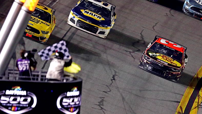 Feb 14, 2021; Daytona Beach, Florida, USA; NASCAR Cup Series driver Michael McDowell (34) leads NASCAR Cup Series driver Chase Elliot (9) to win the during the Daytona 500 at Daytona International Speedway. Mandatory Credit: Mark J. Rebilas-USA TODAY Sports