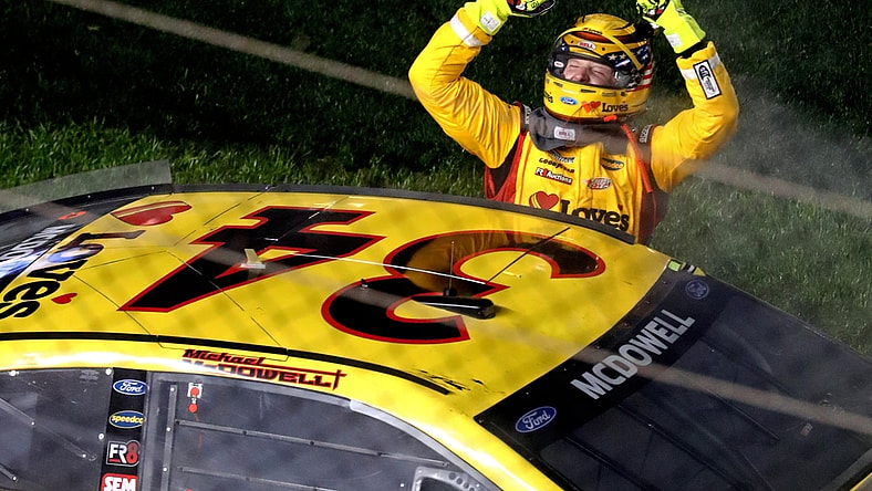 Feb 14, 2021; Daytona Beach, Florida, USA; NASCAR Cup Series driver Michael McDowell (34) celebrates winning the Daytona 500 at Daytona International Speedway. Mandatory Credit: Mark J. Rebilas-USA TODAY Sports