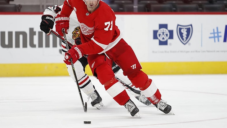 Feb 15, 2021; Detroit, Michigan, USA; Detroit Red Wings center Dylan Larkin (71) skates with the puck during the third period against the Chicago Blackhawks at Little Caesars Arena. Mandatory Credit: Raj Mehta-USA TODAY Sports