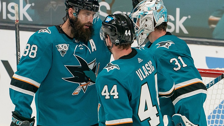 Feb 15, 2021; San Jose, California, USA;  San Jose Sharks defenseman Brent Burns (88) celebrates with goaltender Martin Jones (31) and defenseman Marc-Edouard Vlasic (44) after defeating the Anaheim Ducks at SAP Center at San Jose. Mandatory Credit: Stan Szeto-USA TODAY Sports