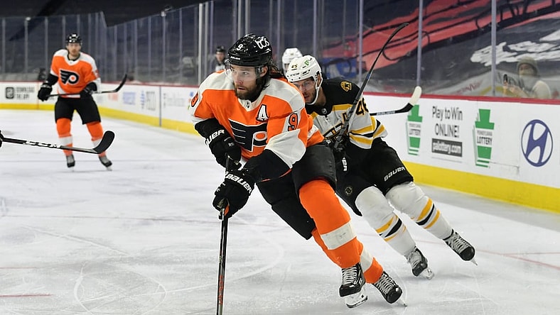 Feb 5, 2021; Philadelphia, Pennsylvania, USA; Philadelphia Flyers defenseman Ivan Provorov (9) carries the puck against the Boston Bruins at Wells Fargo Center. Mandatory Credit: Eric Hartline-USA TODAY Sports