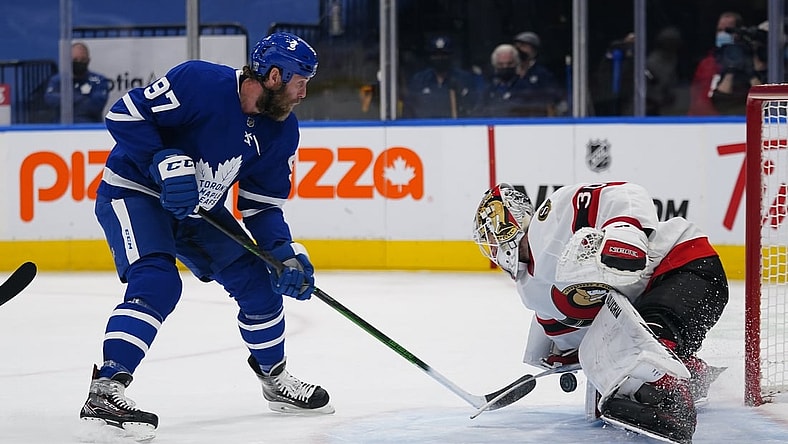 Feb 17, 2021; Toronto, Ontario, CAN; Ottawa Senators goaltender Matt Murray (30) makes a save on a shot by Toronto Maple Leafs forward Joe Thornton (97) during the first period at Scotiabank Arena. Mandatory Credit: John E. Sokolowski-USA TODAY Sports