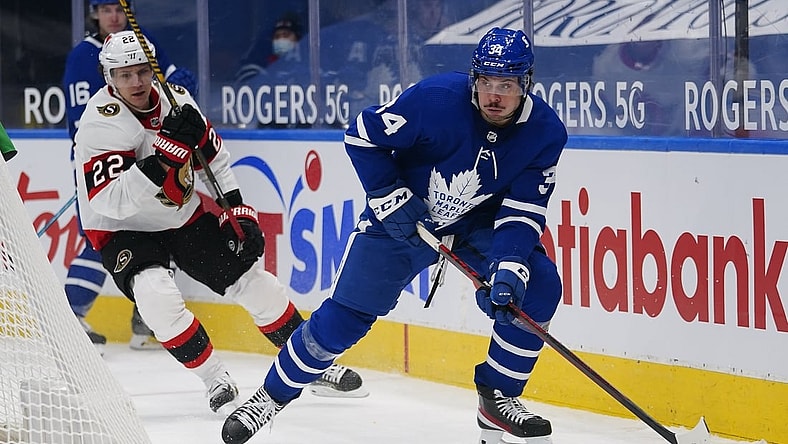 Feb 17, 2021; Toronto, Ontario, CAN; Toronto Maple Leafs forward Auston Matthews (34) skates past Ottawa Senators defenseman Nikita Zaitsev (22) during the third period at Scotiabank Arena. Mandatory Credit: John E. Sokolowski-USA TODAY Sports