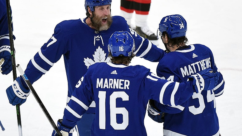 Feb 18, 2021; Toronto, Ontario, CAN;  Toronto Maple Leafs forward Auston Matthews (34) celebrates scoring against Ottawa Senators with forwards Mitchell Marner (16) and Joe Thornton (97) in the first period at Scotiabank Arena. Mandatory Credit: Dan Hamilton-USA TODAY Sports