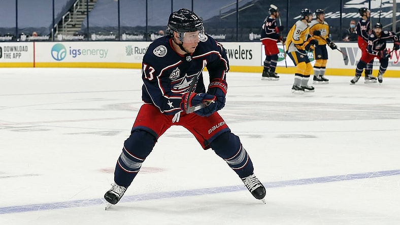 Feb 18, 2021; Columbus, Ohio, USA; Columbus Blue Jackets right wing Cam Atkinson (13) looks to shoot against the Nashville Predators during the first period at Nationwide Arena. Mandatory Credit: Russell LaBounty-USA TODAY Sports