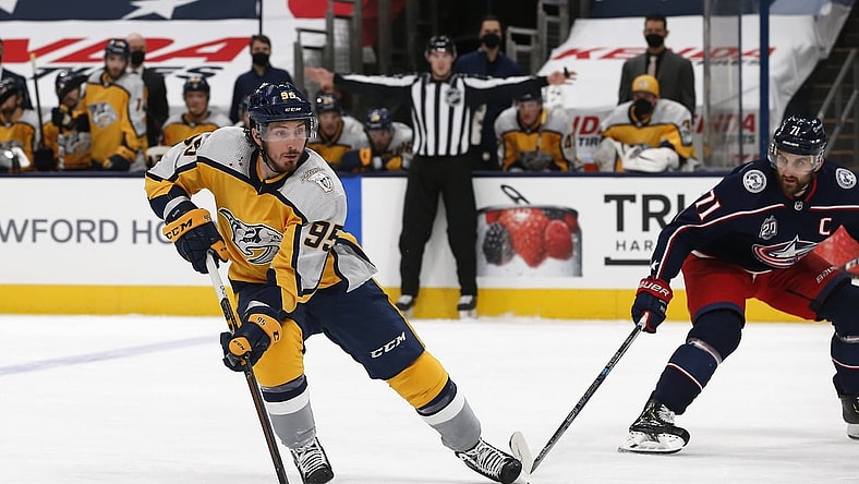 Feb 18, 2021; Columbus, Ohio, USA; Nashville Predators center Matt Duchene (95) carries the puck as Columbus Blue Jackets left wing Nick Foligno (71) defends during the second period at Nationwide Arena. Mandatory Credit: Russell LaBounty-USA TODAY Sports