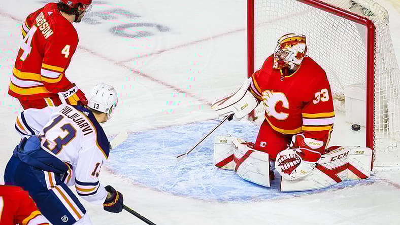 Feb 19, 2021; Calgary, Alberta, CAN; Calgary Flames goaltender David Rittich (33) reacts as Edmonton Oilers right wing Jesse Puljujarvi (13) scores a goal during the first period at Scotiabank Saddledome. Mandatory Credit: Sergei Belski-USA TODAY Sports