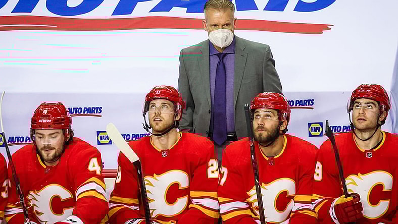 Feb 19, 2021; Calgary, Alberta, CAN; Calgary Flames head coach Geoff Ward on his bench against the Edmonton Oilers during the second period at Scotiabank Saddledome. Mandatory Credit: Sergei Belski-USA TODAY Sports