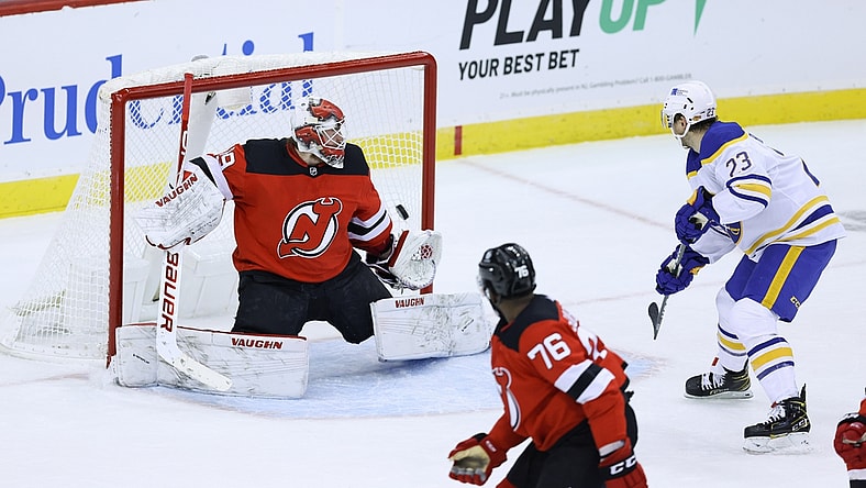 Feb 20, 2021; Newark, New Jersey, USA; Buffalo Sabres center Sam Reinhart (23) shoots the puck past New Jersey Devils goaltender Mackenzie Blackwood (29) for a goal during the second period at Prudential Center. Mandatory Credit: Vincent Carchietta-USA TODAY Sports