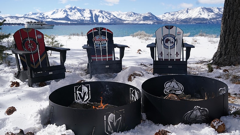 Feb 20, 2021; Stateline, NV, USA; General view of fire pits with the Colorado Avalanche and Vegas Golden Knights logos in the first period of a NHL Outdoors hockey game at Lake Tahoe. Mandatory Credit: Kirby Lee-USA TODAY Sports