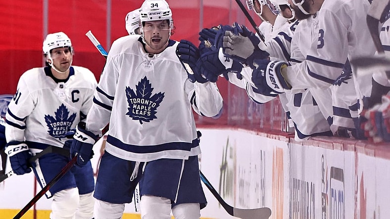 Feb 20, 2021; Montreal, Quebec, CAN; Toronto Maple Leafs center Auston Matthews (34) celebrates his goal against Montreal Canadiens with teammates during the second period at Bell Centre. Mandatory Credit: Jean-Yves Ahern-USA TODAY Sports