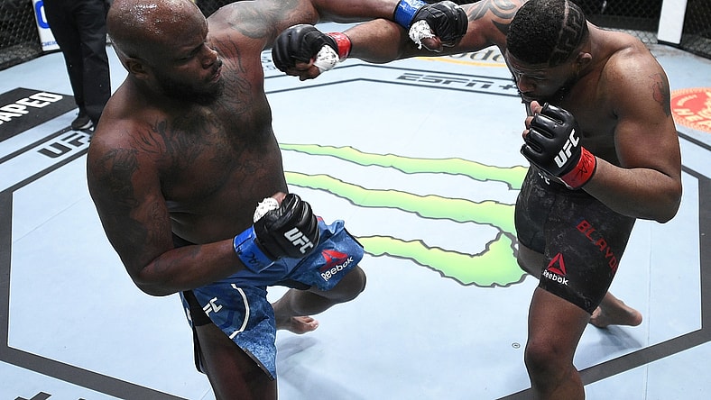 Feb 20, 2021; Las Vegas, NV, USA;   Derrick Lewis and Curtis Blaydes trade punches in a heavyweight bout during the UFC Fight Night event at UFC APEX on February 20, 2021 in Las Vegas, Nevada.  Mandatory Credit: Chris Unger/Handout Photo via USA TODAY Sports