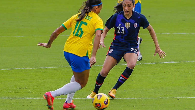 Feb 21, 2021; Orlando, Florida, USA; United States forward Christen Press (23) and Brazil Beatriz forward (16) battle for the ball during the first half of the She Believes Cup soccer match at Exploria Stadium. Mandatory Credit: Mike Watters-USA TODAY Sports