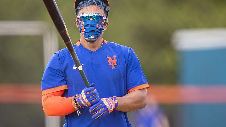 Feb 22, 2021; Port St. Lucie, Florida, USA; New York Mets shortstop Francisco Lindor (12) takes batting practice during the first day of full-squad spring training workouts at Clover Park.  Mandatory Credit: Mary Holt-USA TODAY Sports