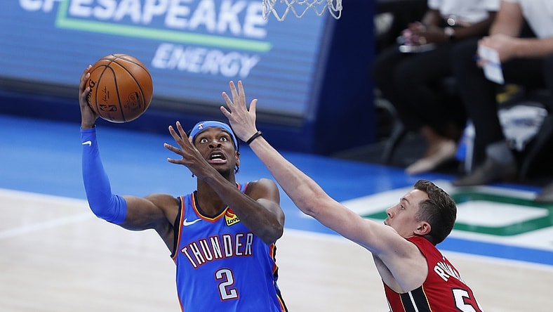 Feb 22, 2021; Oklahoma City, Oklahoma, USA; Oklahoma City Thunder guard Shai Gilgeous-Alexander (2) goes up for a shot as Miami Heat guard Duncan Robinson (55) defends during the first quarter at Chesapeake Energy Arena. Mandatory Credit: Alonzo Adams-USA TODAY Sports