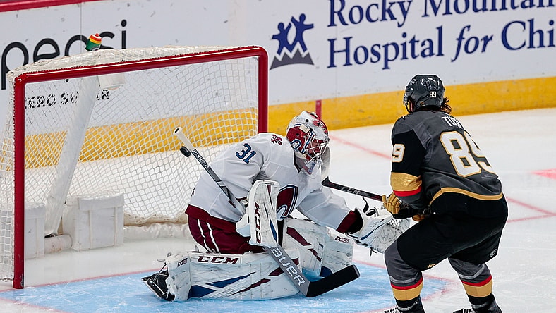 Feb 22, 2021; Denver, Colorado, USA; Vegas Golden Knights right wing Alex Tuch (89) scores on a shot against Colorado Avalanche goaltender Philipp Grubauer (31) in the second period at Ball Arena. Mandatory Credit: Isaiah J. Downing-USA TODAY Sports