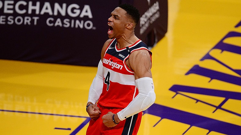 Feb 22, 2021; Los Angeles, California, USA; Washington Wizards guard Russell Westbrook (4) reacts after scoring a basket and drawing a foul against the Los Angeles Lakers during overtime at Staples Center. Mandatory Credit: Gary A. Vasquez-USA TODAY Sports