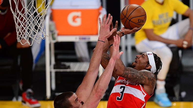 Feb 22, 2021; Los Angeles, California, USA; Washington Wizards guard Bradley Beal (3) shoots against Los Angeles Lakers center Marc Gasol (14) during the second half at Staples Center. Mandatory Credit: Gary A. Vasquez-USA TODAY Sports