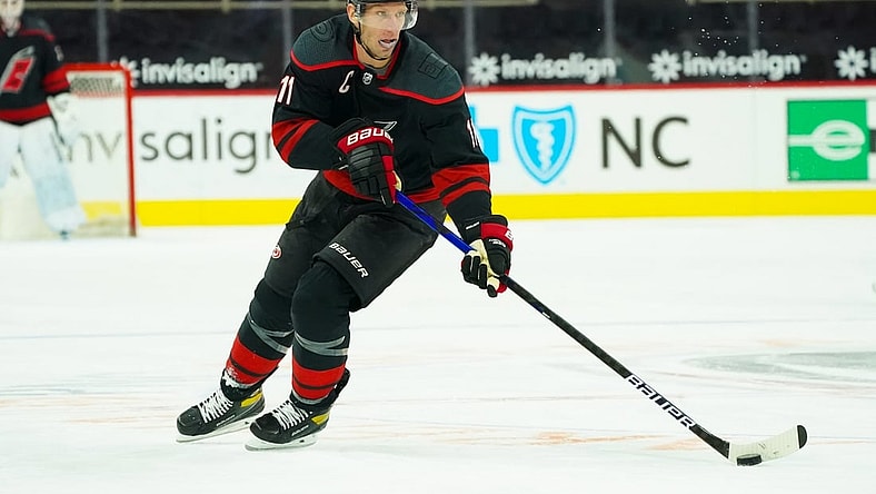 Feb 17, 2021; Raleigh, North Carolina, USA;  Carolina Hurricanes center Jordan Staal (11) skates with the puck against the Florida Panthers at PNC Arena. Mandatory Credit: James Guillory-USA TODAY Sports