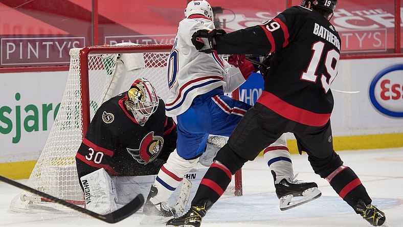 Feb 23, 2021; Ottawa, Ontario, CAN; Ottawa Senators goalie Matt Murray (30) makes a save in front of Montreal Canadiens left wing Tomas Tatar (90) in the first period at the Canadian Tire Centre. Mandatory Credit: Marc DesRosiers-USA TODAY Sports