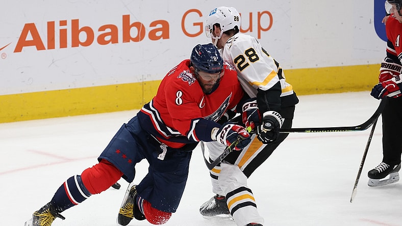 Feb 23, 2021; Washington, District of Columbia, USA; Washington Capitals left wing Alex Ovechkin (8) and Pittsburgh Penguins defenseman Marcus Pettersson (28) battle for the puck in the second period at Capital One Arena. Mandatory Credit: Geoff Burke-USA TODAY Sports
