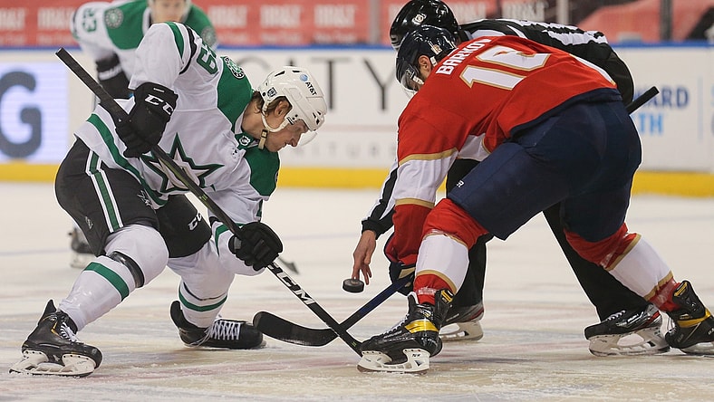 Feb 24, 2021; Sunrise, Florida, USA; Dallas Stars Rhett Gardner (49) and Florida Panthers center Aleksander Barkov (16) face-off during the first period at BB&T Center. Mandatory Credit: Sam Navarro-USA TODAY Sports