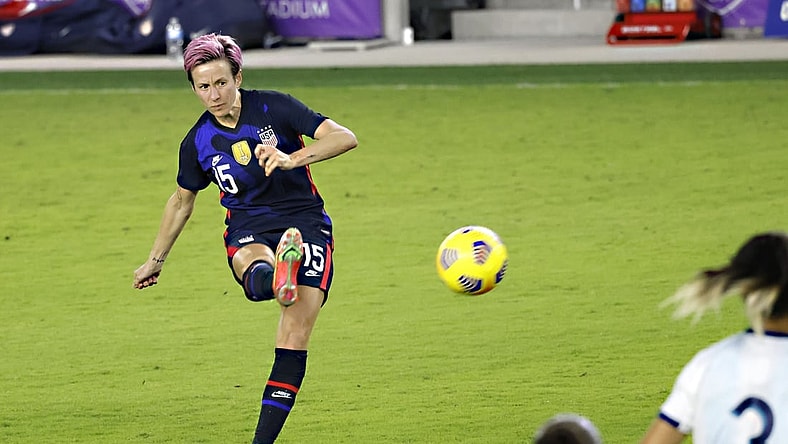 Feb 24, 2021; Orlando, Florida, USA; United States forward Megan Rapinoe (15) kicks the ball during the second half of a She Believes Cup soccer match against Argentina at Exploria Stadium. Mandatory Credit: Reinhold Matay-USA TODAY Sports