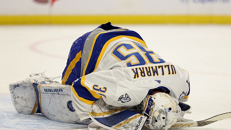 Feb 25, 2021; Buffalo, New York, USA; Buffalo Sabres goaltender Linus Ullmark (35) gets hurt during the first period against the New Jersey Devils at KeyBank Center. Mandatory Credit: Timothy T. Ludwig-USA TODAY Sports