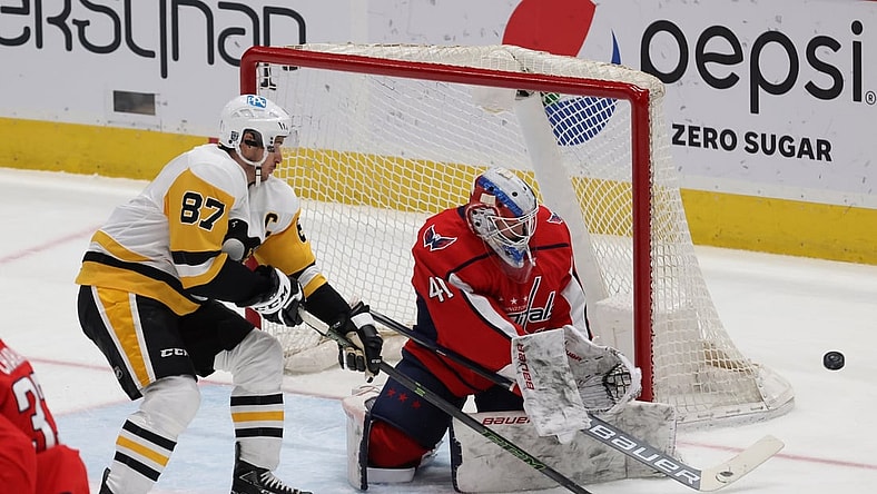 Feb 25, 2021; Washington, District of Columbia, USA; Washington Capitals goaltender Vitek Vanecek (41) m makes a save on Pittsburgh Penguins center Sidney Crosby (87) in the first period at Capital One Arena. Mandatory Credit: Geoff Burke-USA TODAY Sports