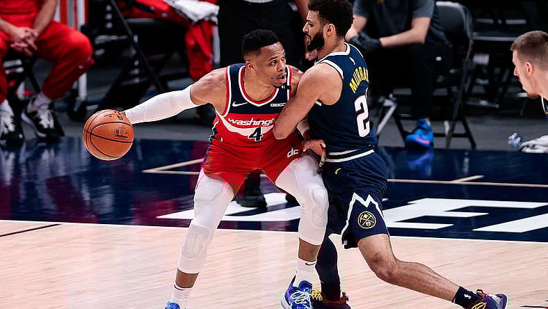 Feb 25, 2021; Denver, Colorado, USA; Washington Wizards guard Russell Westbrook (4) controls the ball as Denver Nuggets guard Jamal Murray (27) guards in the second quarter at Ball Arena. Mandatory Credit: Isaiah J. Downing-USA TODAY Sports