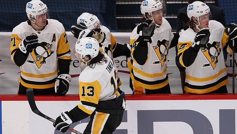 Feb 25, 2021; Washington, District of Columbia, USA; Pittsburgh Penguins left wing Brandon Tanev (13) celebrates with teammates after scoring a goal against the Washington Capitals in the third period at Capital One Arena. Mandatory Credit: Geoff Burke-USA TODAY Sports