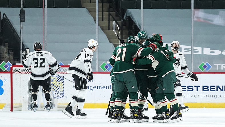 Feb 26, 2021; Saint Paul, Minnesota, USA; The Minnesota Wild celebrate after center Joel Eriksson Ek (14) scored a goal against Los Angeles Kings goaltender Jonathan Quick (32) in the first period at Xcel Energy Center. Mandatory Credit: David Berding-USA TODAY Sports