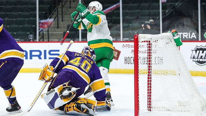 Feb 27, 2021; Saint Paul, Minnesota, USA; Minnesota Wild center Nico Sturm (7) celebrates after scoring a goal against Los Angeles Kings goaltender Calvin Petersen (40) in the first period at Xcel Energy Center. Mandatory Credit: David Berding-USA TODAY Sports