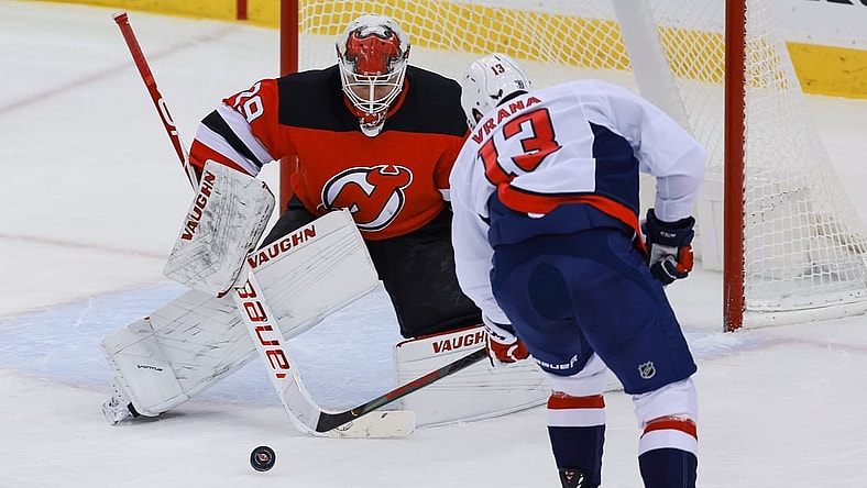 Feb 28, 2021; Newark, New Jersey, USA; Washington Capitals left wing Jakub Vrana (13) scores a goal past New Jersey Devils goaltender Mackenzie Blackwood (29)  during the first period at Prudential Center. Mandatory Credit: Vincent Carchietta-USA TODAY Sports