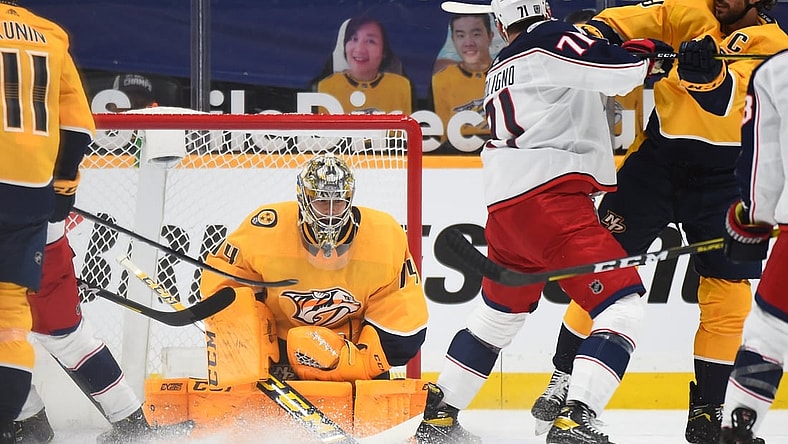 Feb 28, 2021; Nashville, Tennessee, USA; Nashville Predators goaltender Juuse Saros (74) makes a save during the first period against the Columbus Blue Jackets at Bridgestone Arena. Mandatory Credit: Christopher Hanewinckel-USA TODAY Sports