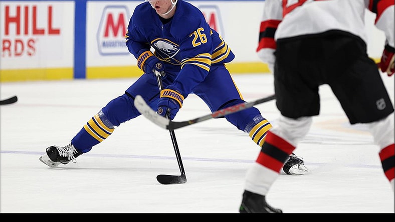 Jan 30, 2021; Buffalo, New York, USA; Buffalo Sabres defenseman Rasmus Dahlin (26) carries the puck up ice during the third period against the New Jersey Devils at KeyBank Center. Mandatory Credit: Timothy T. Ludwig-USA TODAY Sports