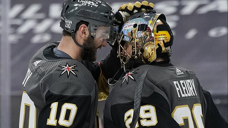Feb 5, 2021; Las Vegas, Nevada, USA; Vegas Golden Knights center Nicolas Roy (10) and goaltender Marc-Andre Fleury (29) celebrate after defeating the Los Angeles Kings in an NHL hockey game Friday, Feb. 5, 2021, in Las Vegas at T-Mobile Arena. Mandatory Credit: John Locher/POOL PHOTOS-USA TODAY Sports