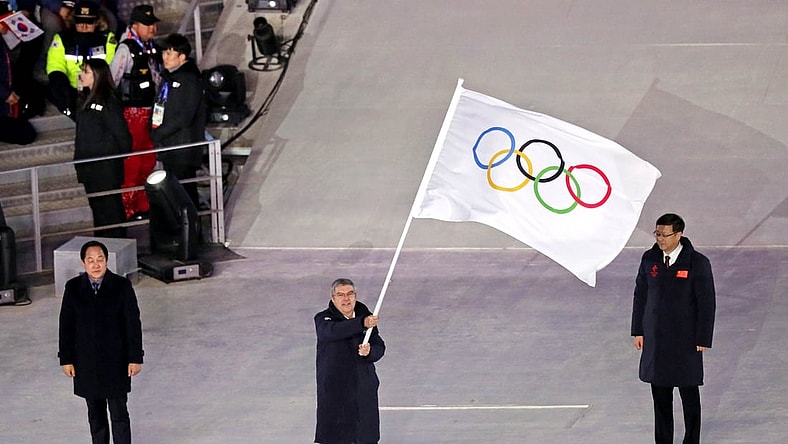 Feb 25, 2018; PyeongChang, South Korea; IOC president Thomas Bach waves the Olympic flag during the closing ceremony for the Pyeongchang 2018 Olympic Winter Games at Pyeongchang Olympic Stadium. Mandatory Credit: Soobum Im-USA TODAY Sports