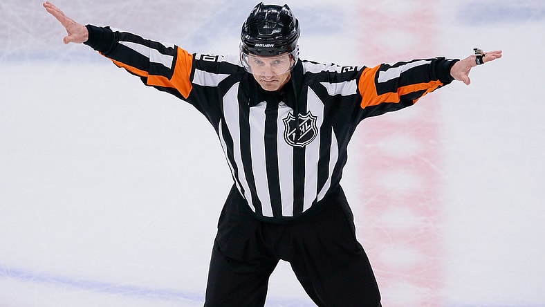 Apr 22, 2018; Denver, CO, USA; Referee Tim Peel (20) waves off a Colorado Avalanche goal in the second period against the Nashville Predators in game six of the first round of the 2018 Stanley Cup Playoffs at the Pepsi Center. Mandatory Credit: Isaiah J. Downing-USA TODAY Sports