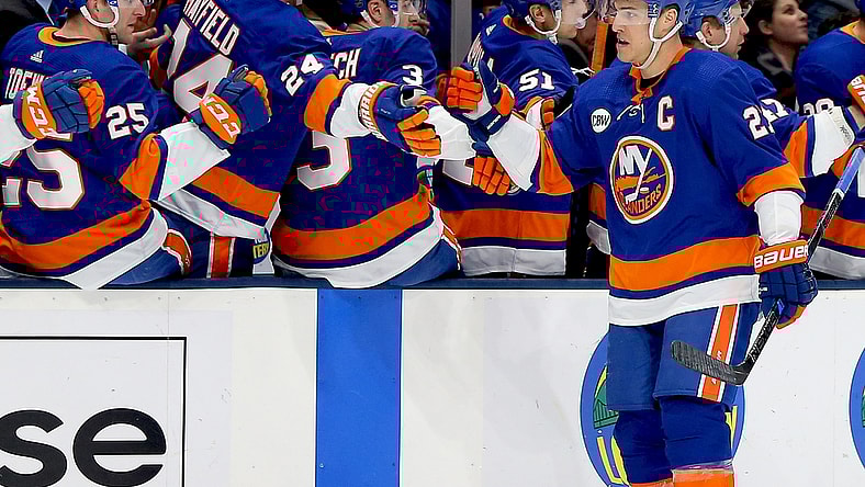 Jan 17, 2019; Uniondale, NY, USA; New York Islanders left wing Anders Lee (27) celebrates with teammates on the bench after scoring a goal against the New Jersey Devils during the first period at Nassau Veterans Memorial Coliseum. Mandatory Credit: Andy Marlin-USA TODAY Sports