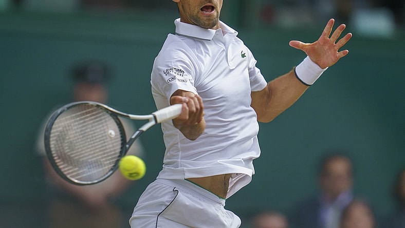 Jul 14, 2019; London, United Kingdom; Novak Djokovic (SRB) in action during the mens final match against Roger Federer (SUI) on day 13 at the All England Lawn and Croquet Club. Mandatory Credit: Susan Mullane-USA TODAY Sports