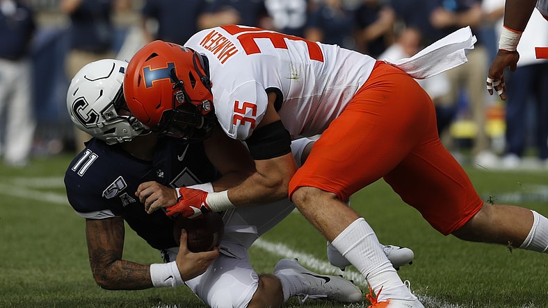 Sep 7, 2019; East Hartford, CT, USA; Illinois Fighting Illini linebacker Jake Hansen (35) sacks Connecticut Huskies quarterback Jack Zergiotis (11) in the second quarter at Pratt & Whitney Stadium at Rentschler Field. Mandatory Credit: David Butler II-USA TODAY Sports