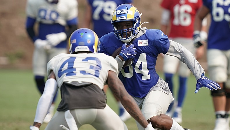 Aug 18, 2020; Thousand Oaks California, USA; Los Angeles Rams running back Malcolm Brown (34) is defended by safety John Johnson III (43) during training camp at Cal Lutheran University. Mandatory Credit: Kirby Lee-USA TODAY Sports